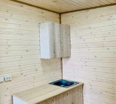 Каркасная баня длиной 7 м с верандой и отделкой из дерева